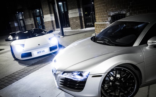 Image white porsche 911 parked near building