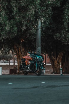 Wallpaper Green and Black Motorcycle Parked on Gray Concrete Road