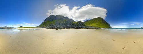 Image green mountain beside body of water during daytime