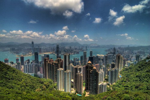 Image city skyline under blue and white cloudy sky during daytime