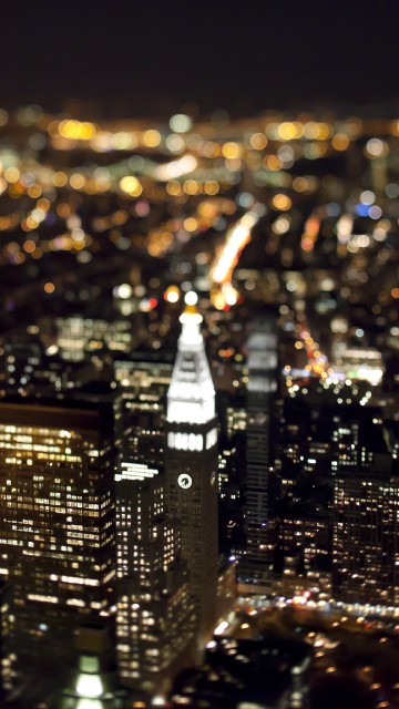 Image city with high rise buildings during night time