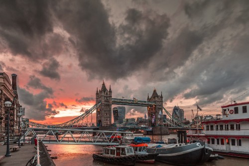 Image bridge over body of water under cloudy sky during daytime