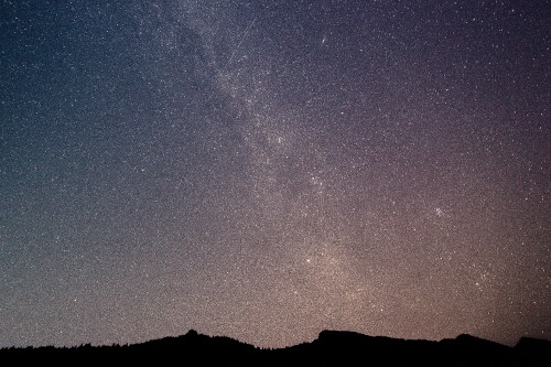 Image silhouette of mountain under starry night