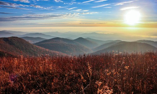 Image brown grass field near mountains during daytime