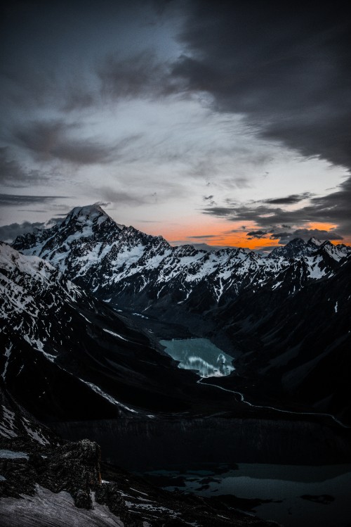 Image snow covered mountain under cloudy sky during daytime