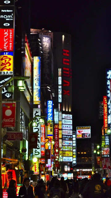 Image people walking on street during nighttime