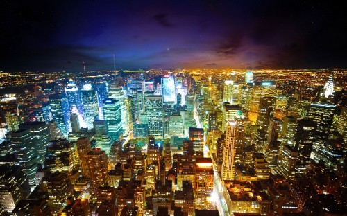 Image city with high rise buildings during night time