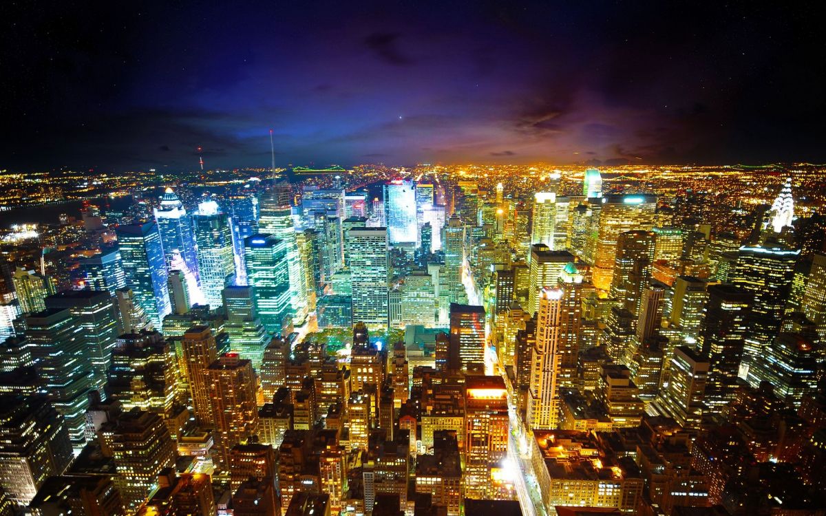 city with high rise buildings during night time