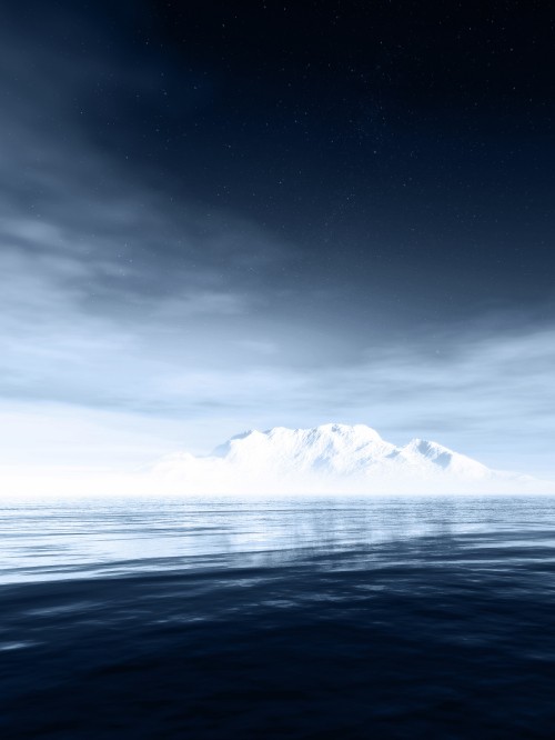 Image snow covered mountain near body of water during night time