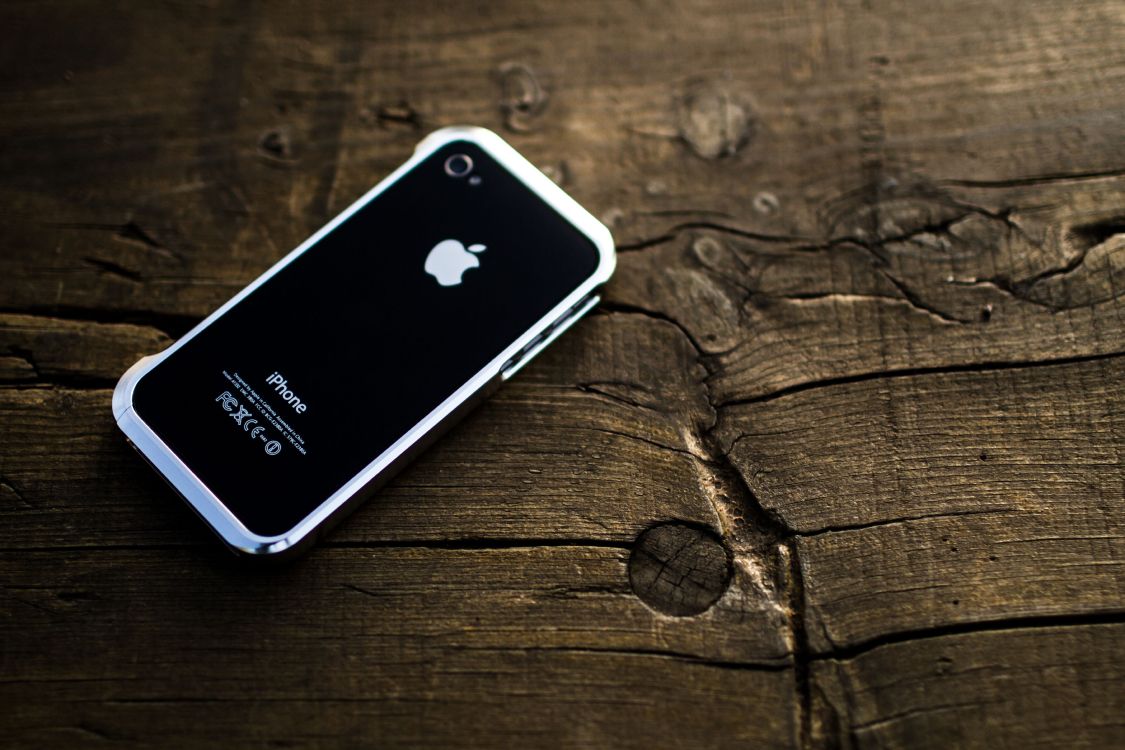 Black Iphone 4 on Brown Wooden Table. Wallpaper in 5184x3456 Resolution