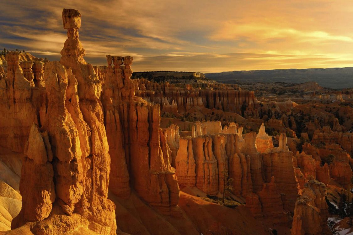 brown rock formation under cloudy sky during daytime