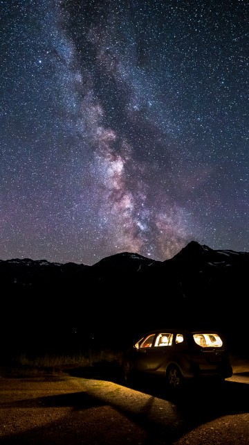 Image white suv on road during night time