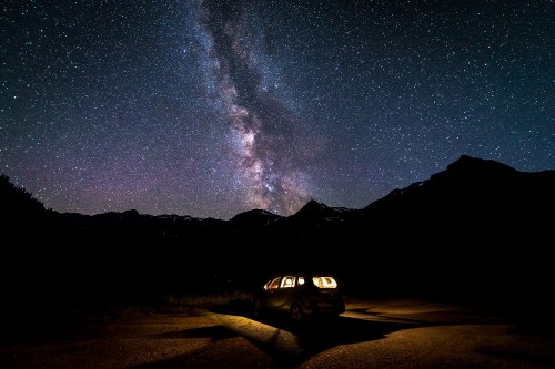 Image white suv on road during night time