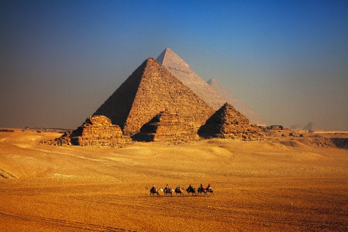 Image brown pyramid on desert during daytime