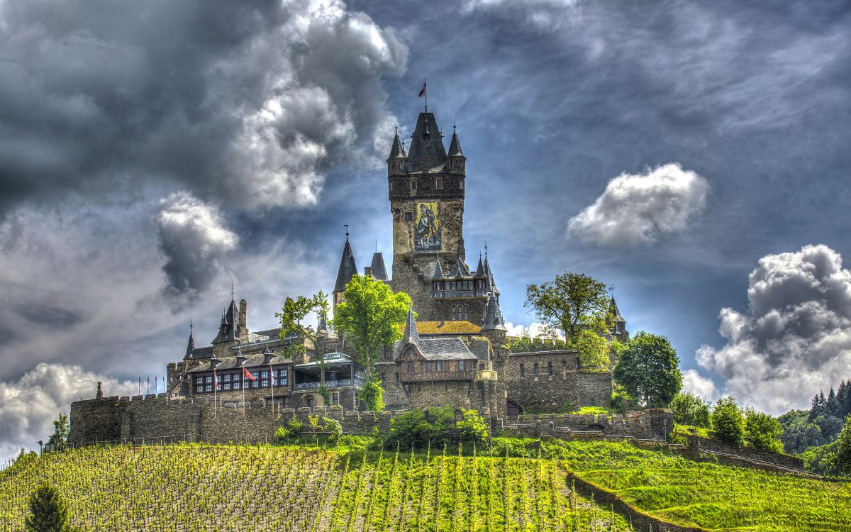 green and yellow castle under cloudy sky