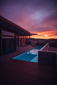 Wallpaper Swimming Pool Near Brown Wooden House During Sunset