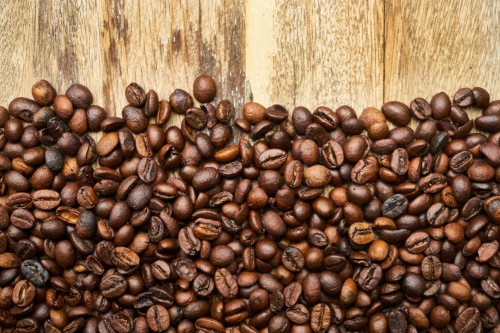 Image coffee beans on brown wooden table