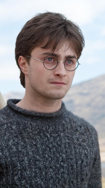 Image man in gray sweater wearing black framed eyeglasses