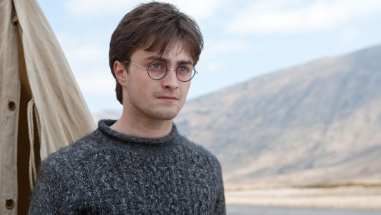 Image man in gray sweater wearing black framed eyeglasses