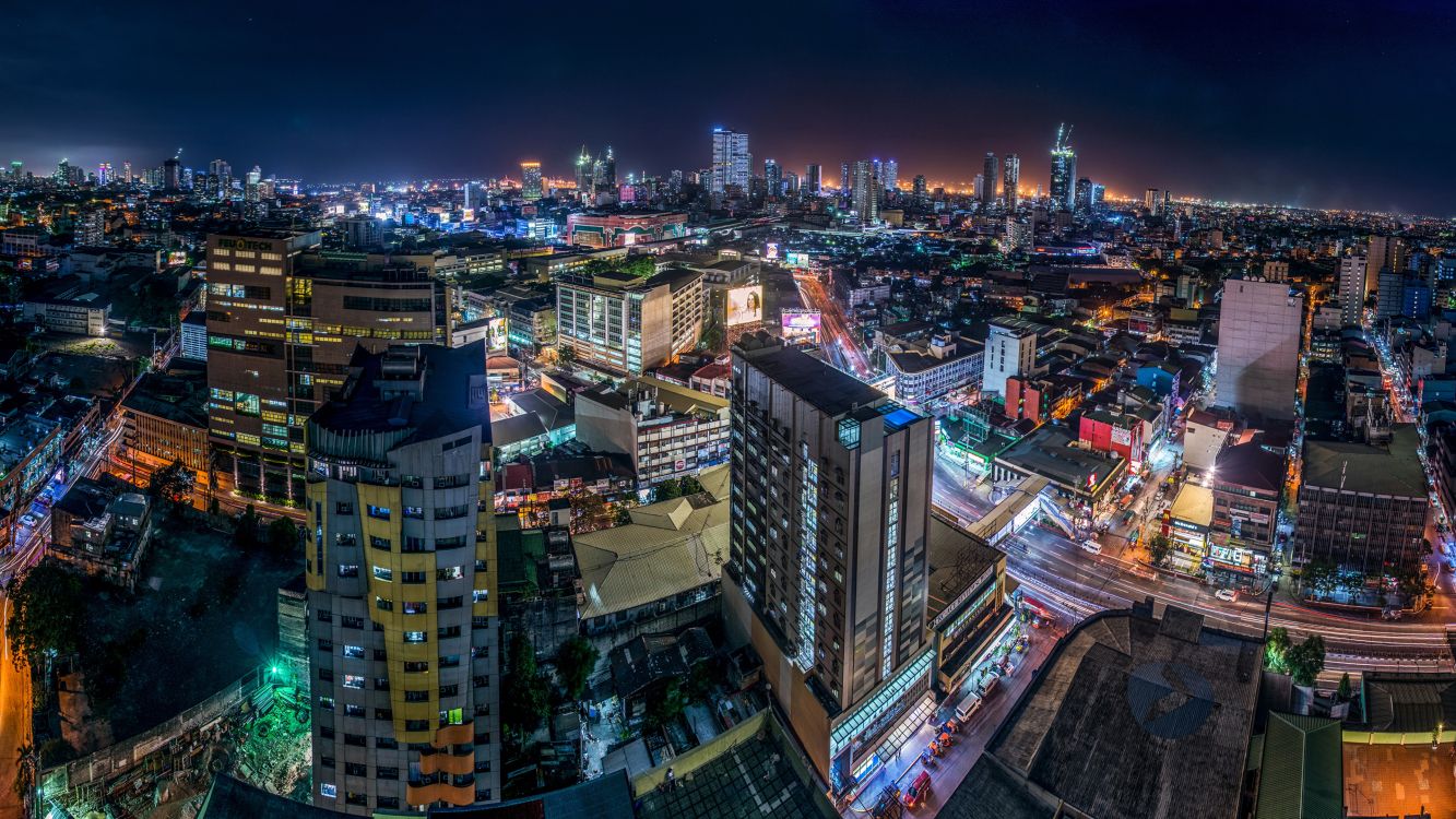Vista Aérea de Los Edificios de la Ciudad Durante la Noche.. Wallpaper in 3840x2160 Resolution
