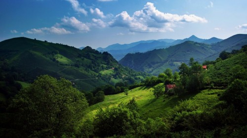 Image green mountains under blue sky during daytime