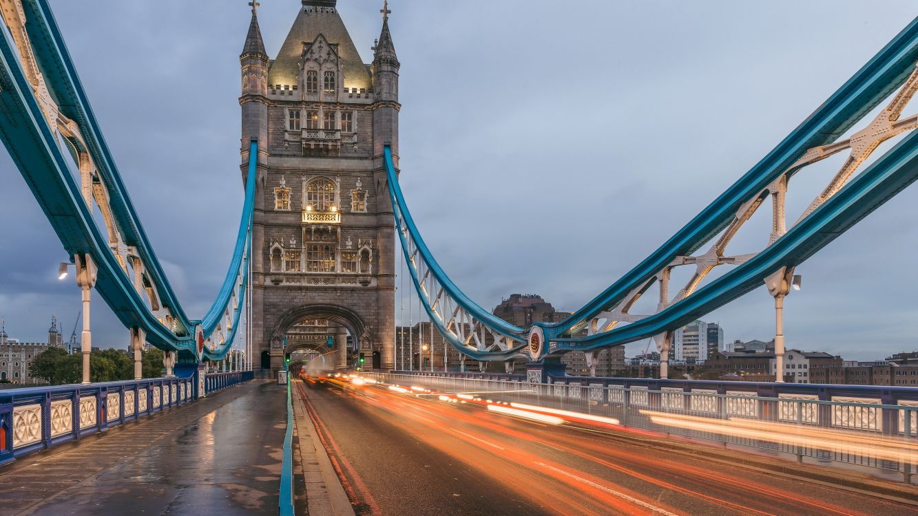 time lapse photography of cars on bridge during night time