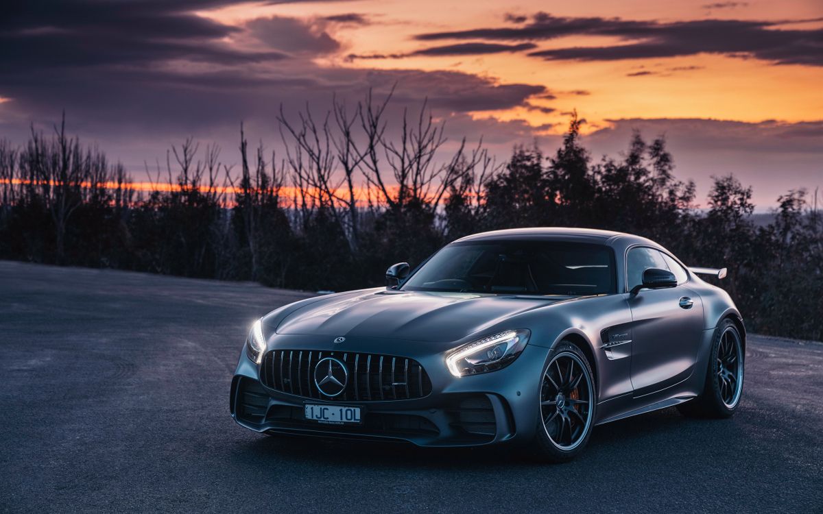 black mercedes benz coupe on road during sunset