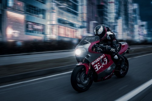 Image man in black and red motorcycle helmet riding on red and black sports bike