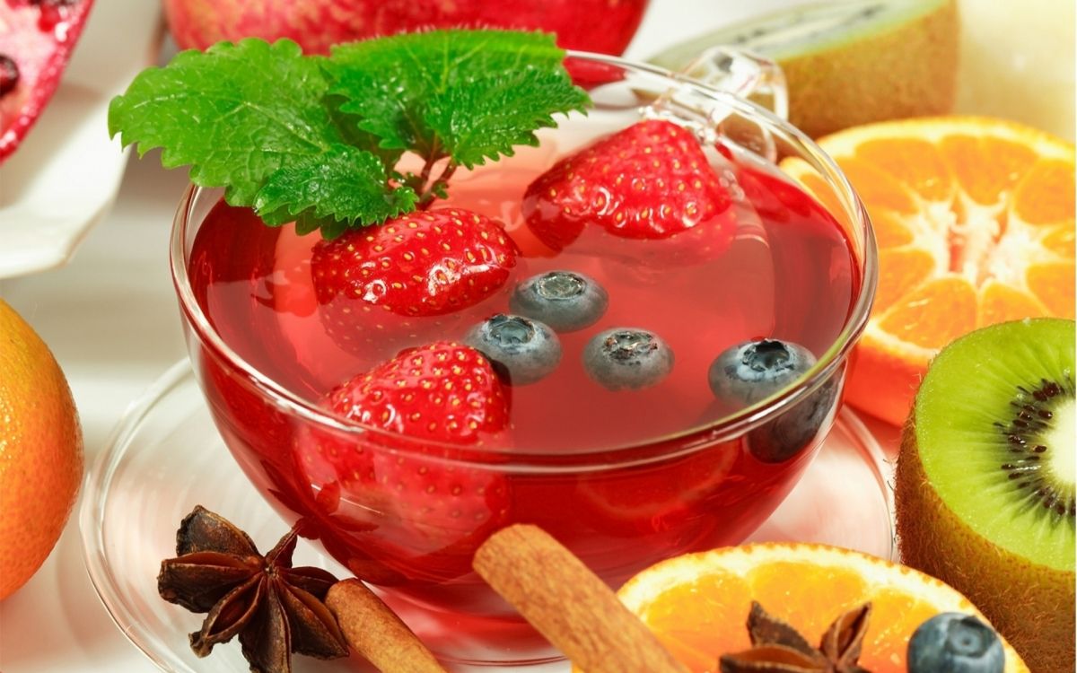 strawberry juice in clear glass cup