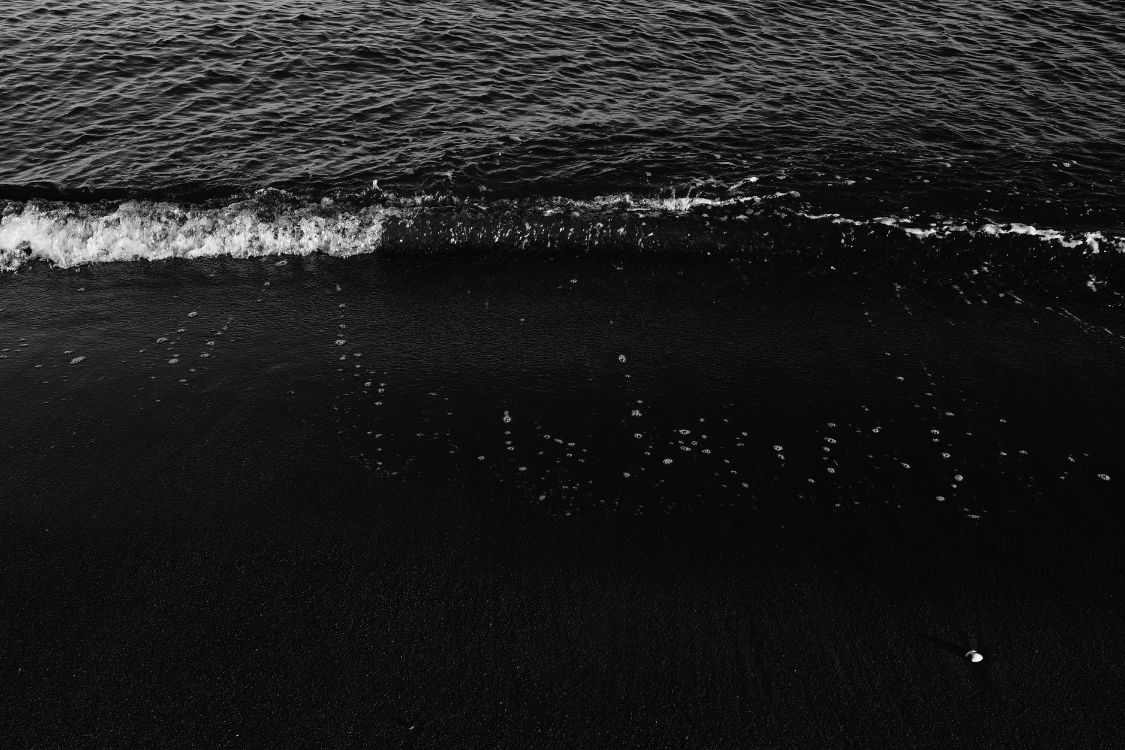 water waves hitting the shore