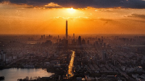 Image city skyline during sunset with body of water