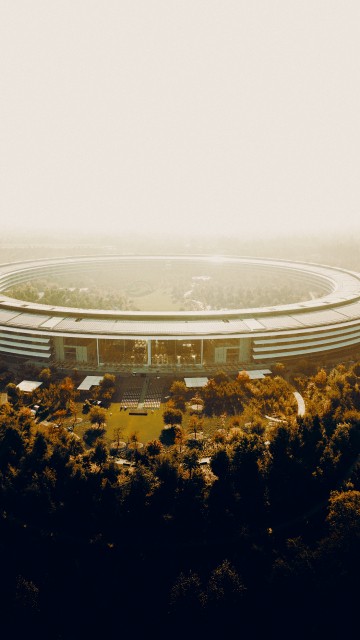 Image white and gray building on top of hill