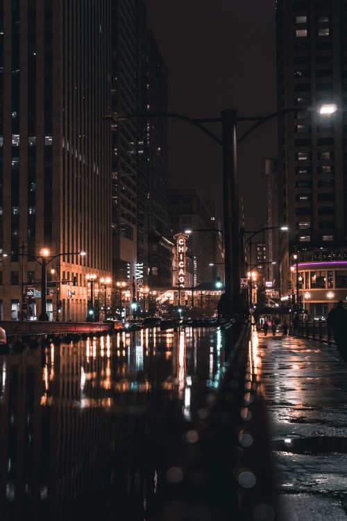 Image people walking on sidewalk during night time