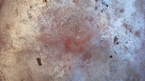 Image person wearing black shoes standing on brown concrete floor