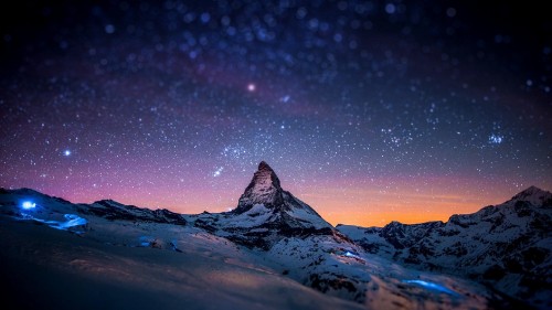 Image snow covered mountain under starry night