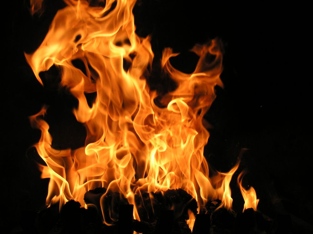 fire in black background with black background