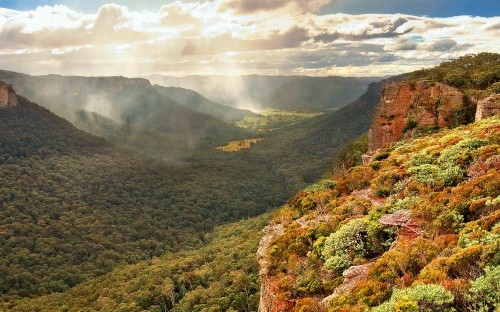 Image green mountains under white clouds during daytime