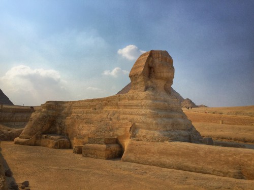 Image brown rock formation under white clouds during daytime