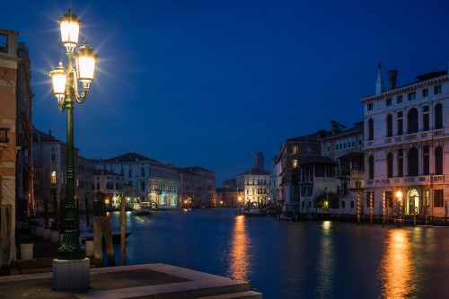 Image body of water between buildings during night time