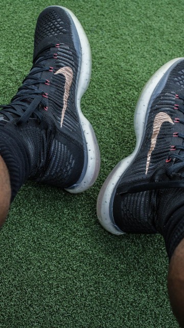 Image person wearing black and white nike athletic shoes
