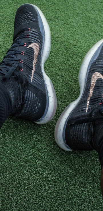 Image person wearing black and white nike athletic shoes