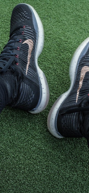 Image person wearing black and white nike athletic shoes