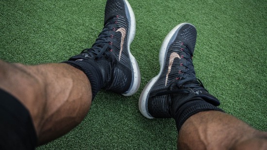 Image person wearing black and white nike athletic shoes