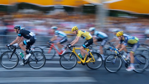 Image people riding bicycle on road during daytime