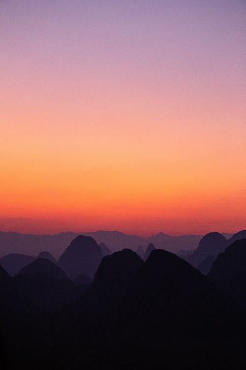 silhouette of mountains during sunset