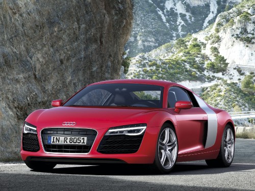 Image red audi r 8 parked on rocky mountain during daytime