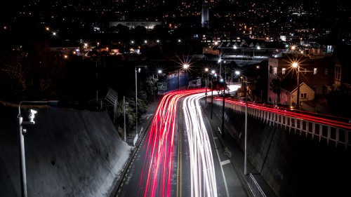 Image time lapse photography of cars on road during night time