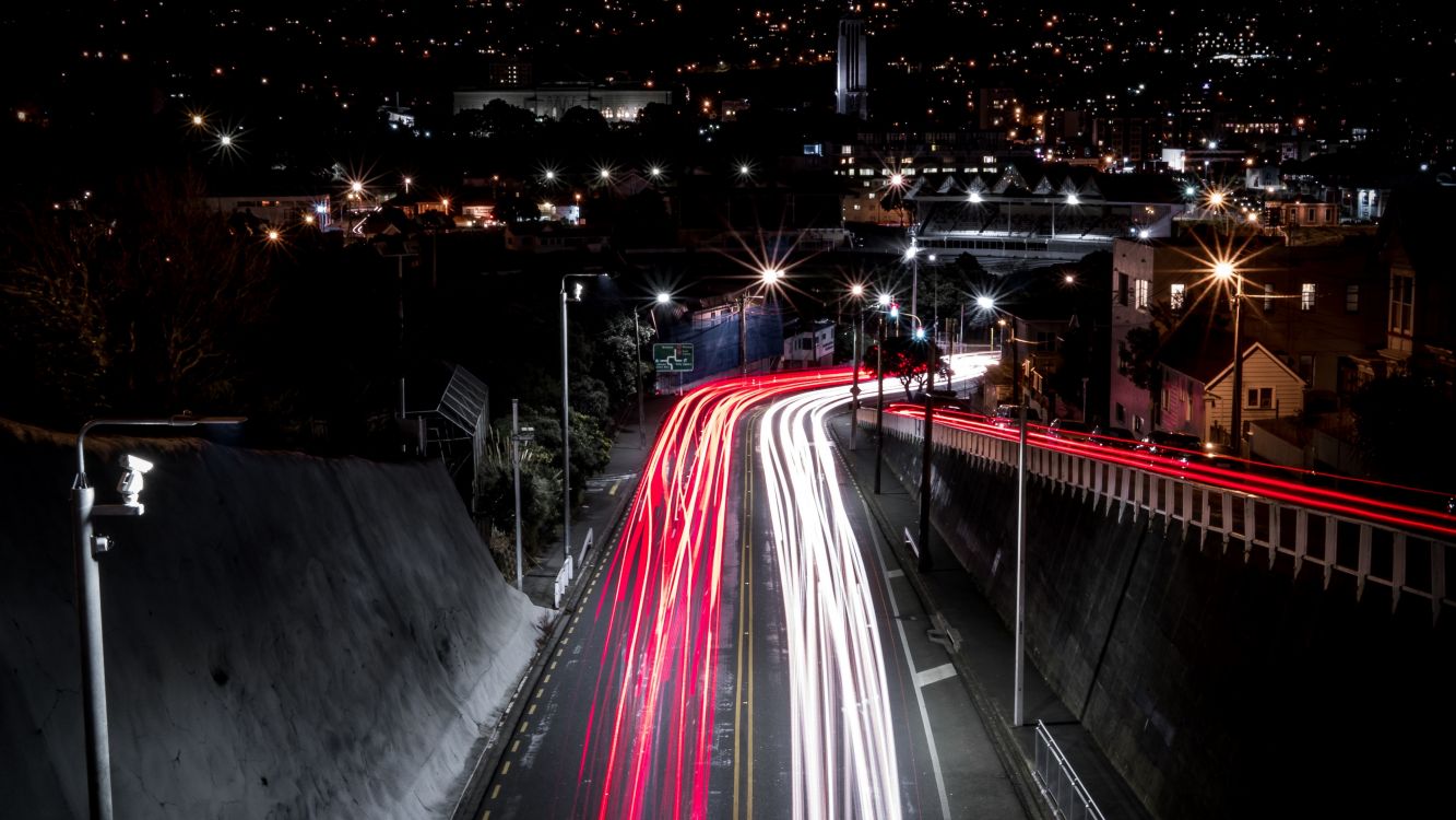 time lapse photography of cars on road during night time