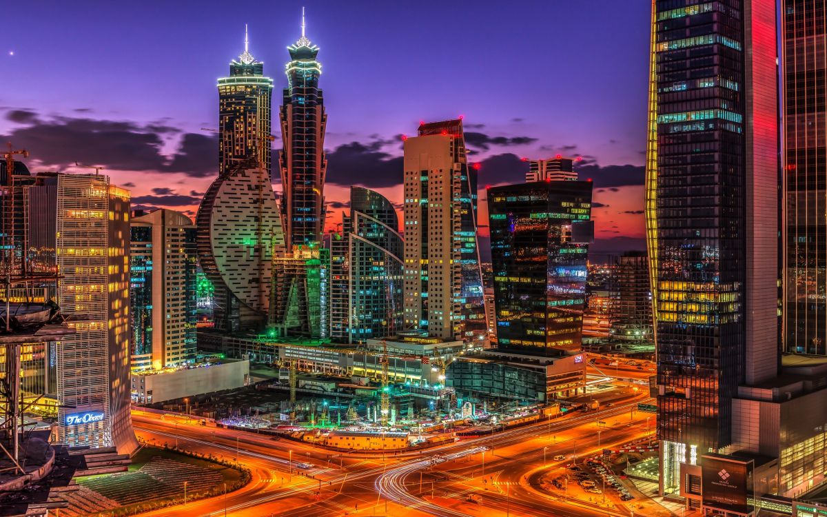 city buildings with lights during night time