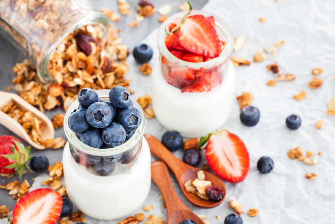 white cream with red and blue berries on top